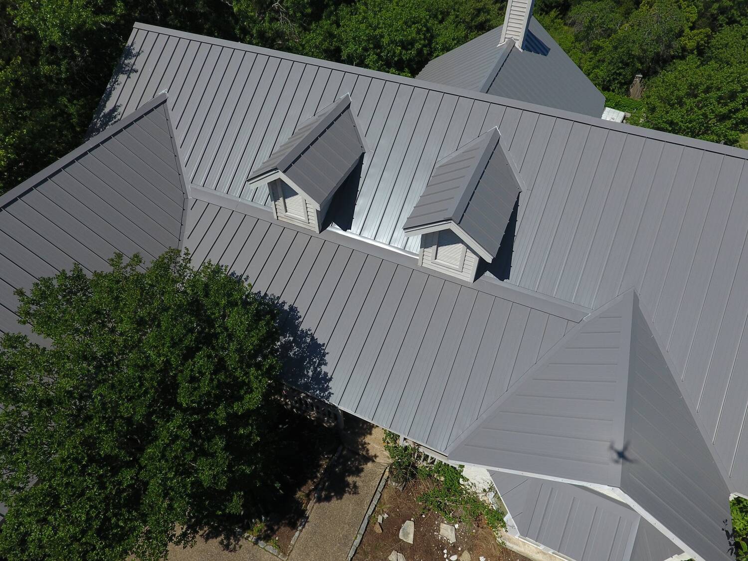 big house with gray metal roofing